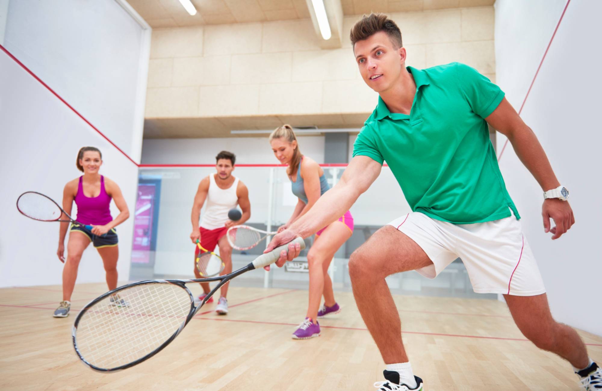 active young people playing squash