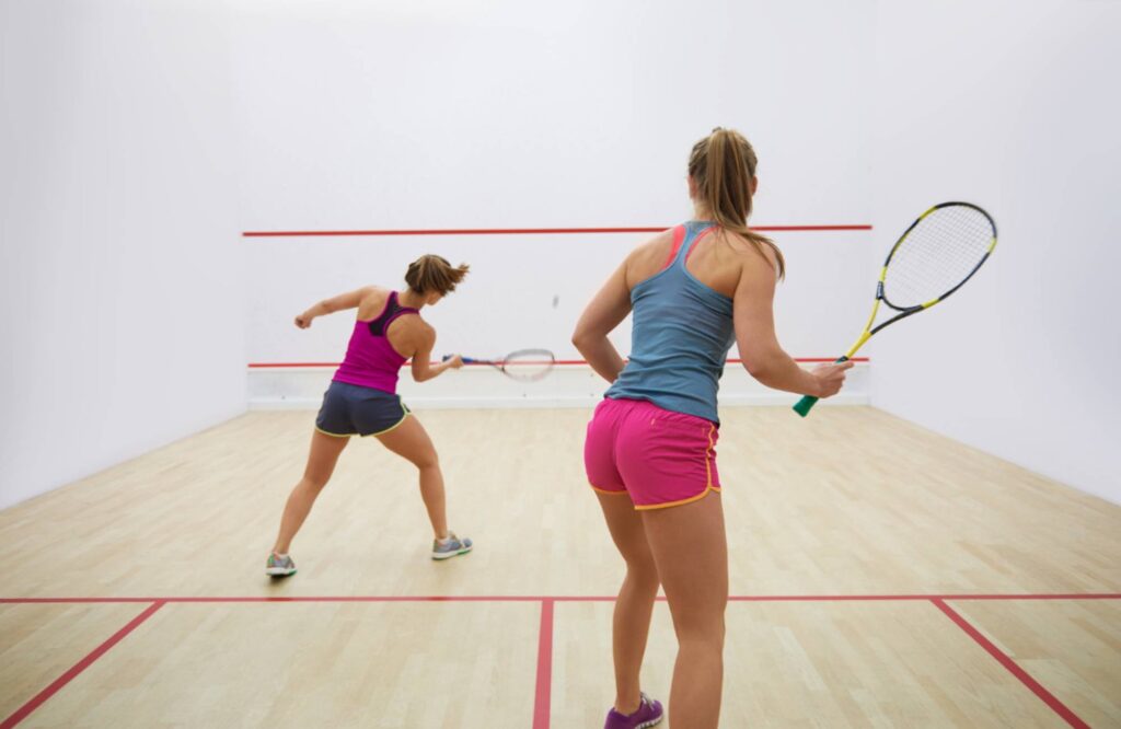 active young people playing squash