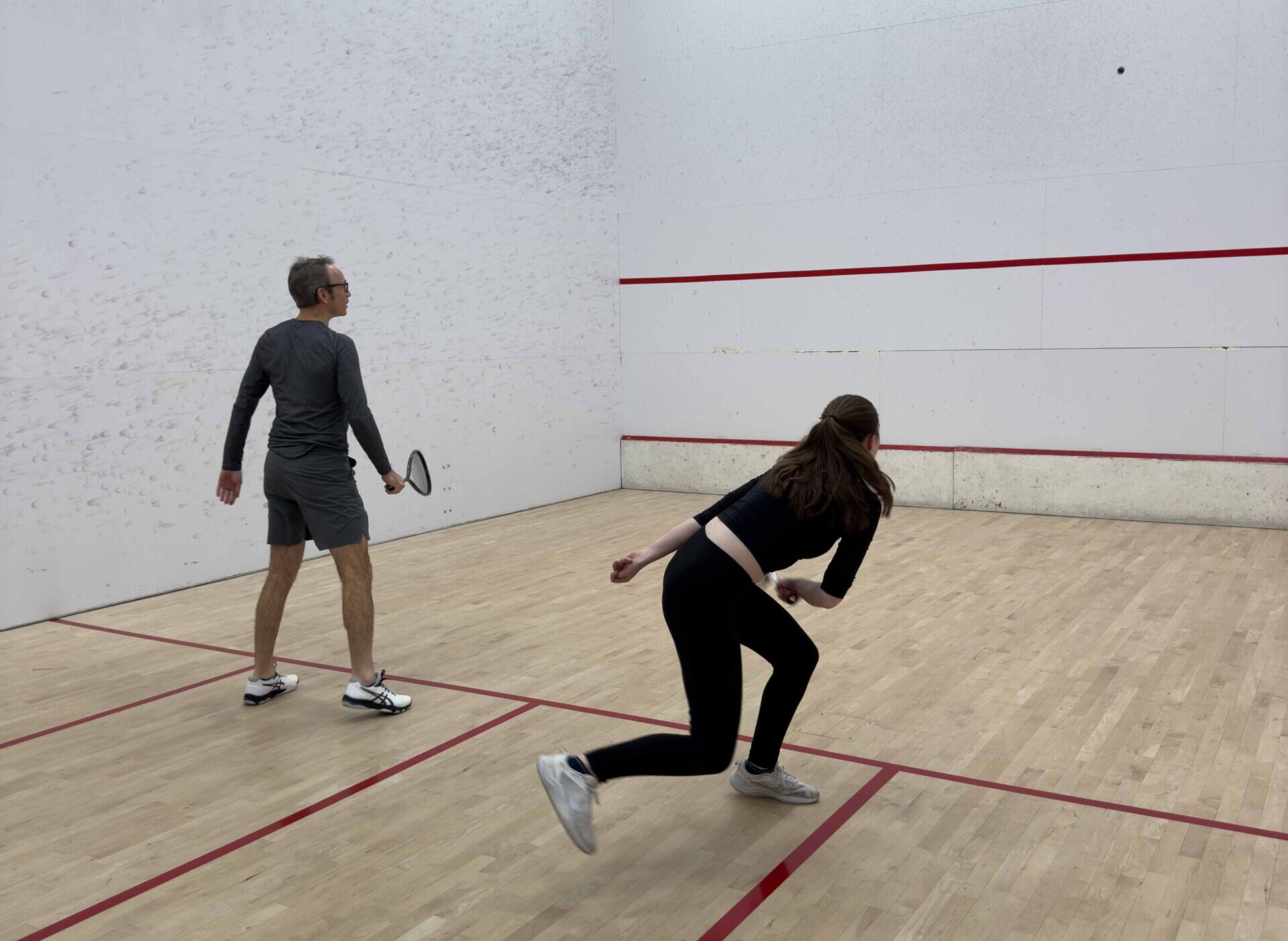 playing squash at contenders in downtown Vancouver courts